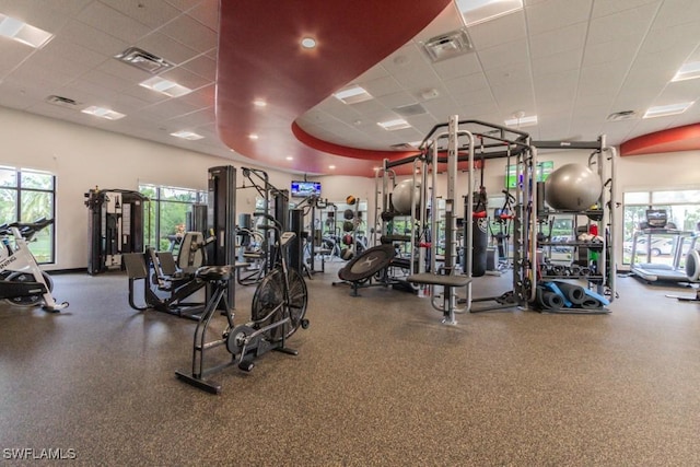 gym featuring a paneled ceiling