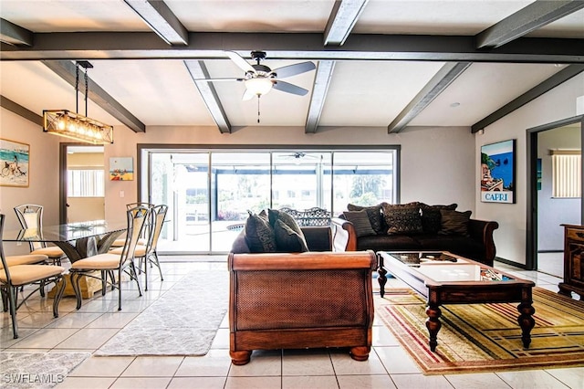 living room featuring ceiling fan, light tile patterned floors, and beam ceiling