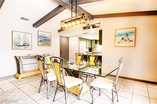 dining area featuring light tile patterned floors and lofted ceiling with beams