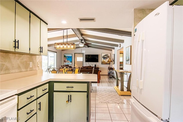 kitchen featuring white fridge, vaulted ceiling with beams, kitchen peninsula, light tile patterned flooring, and hanging light fixtures