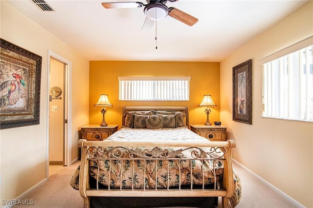 carpeted bedroom with ceiling fan