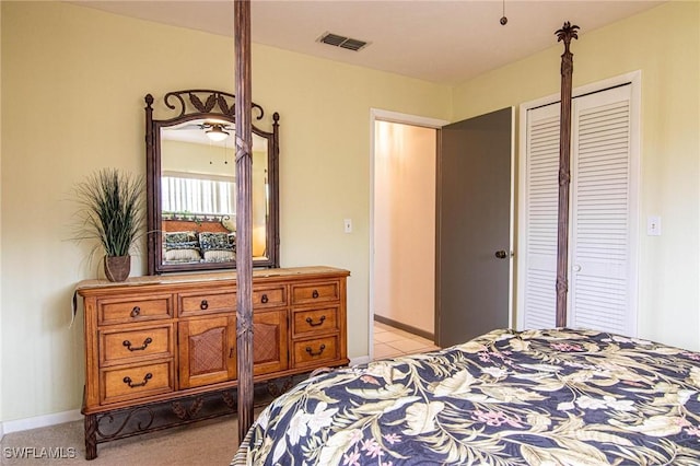 carpeted bedroom with a closet