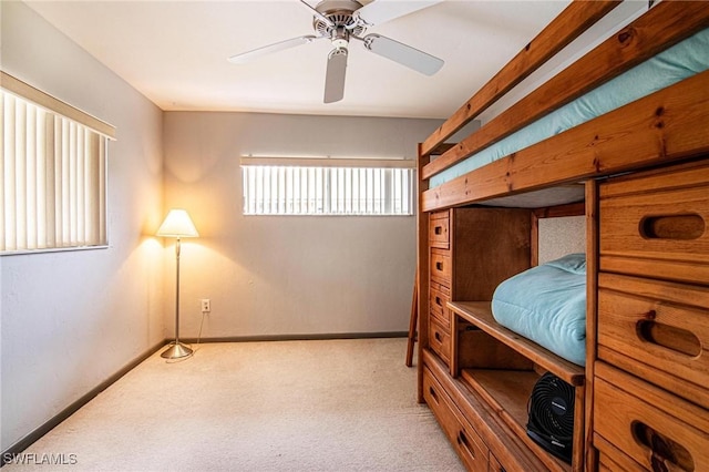 bedroom featuring ceiling fan and light colored carpet