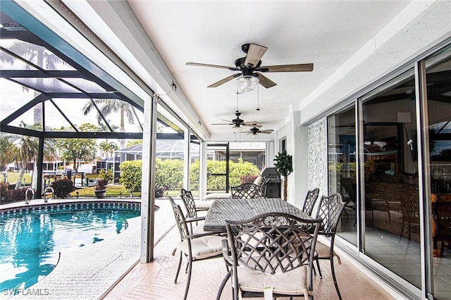 exterior space with ceiling fan and a swimming pool