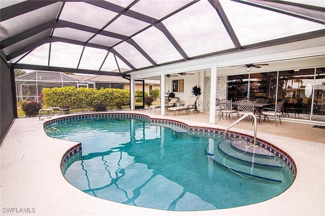 view of pool featuring ceiling fan, a lanai, and a patio