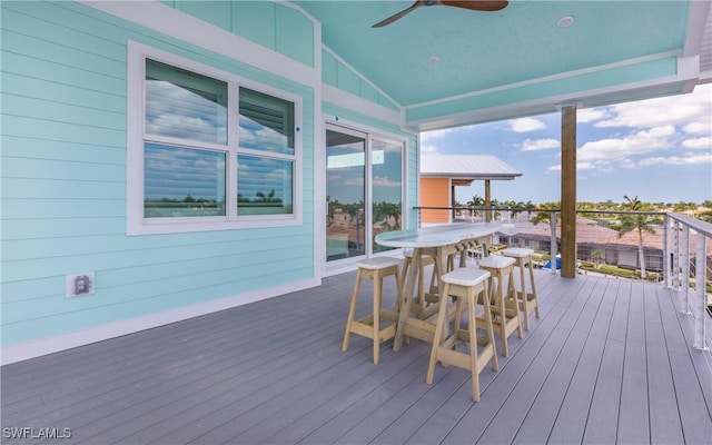 wooden terrace featuring ceiling fan