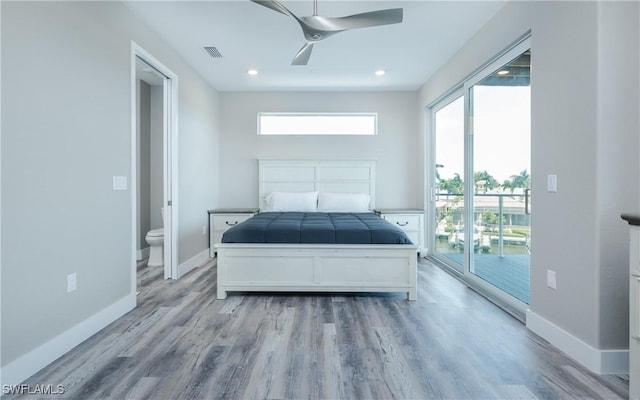 bedroom with ceiling fan, light hardwood / wood-style flooring, access to outside, and ensuite bath