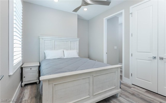 bedroom featuring ceiling fan and hardwood / wood-style flooring