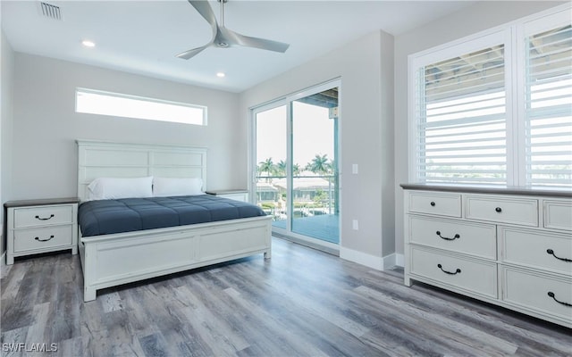 bedroom featuring ceiling fan, hardwood / wood-style floors, and access to outside