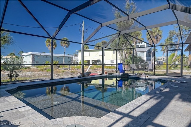 view of pool with a lanai and a patio