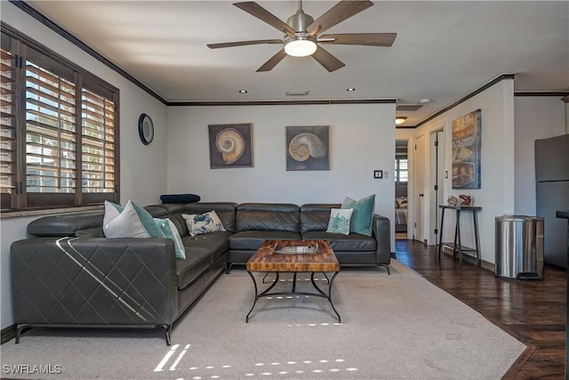 living room featuring ceiling fan, crown molding, and dark hardwood / wood-style floors