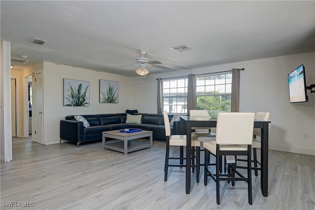 dining area featuring ceiling fan and light hardwood / wood-style floors