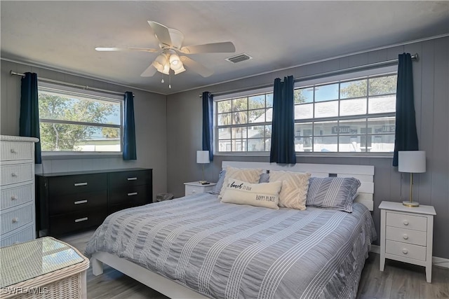 bedroom featuring ceiling fan and dark hardwood / wood-style floors