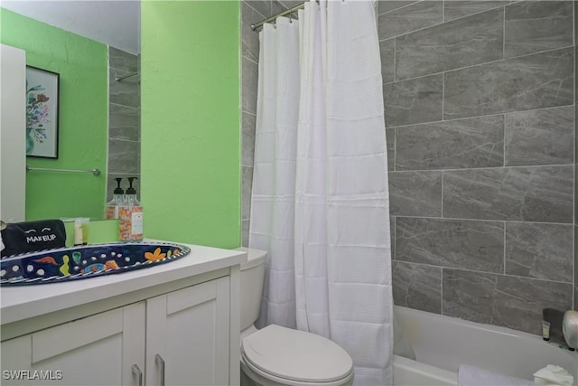 full bathroom featuring toilet, shower / bath combo, and sink