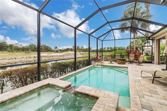 view of swimming pool with a patio area, an in ground hot tub, an outdoor fire pit, glass enclosure, and a water view