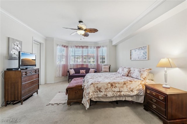 bedroom with crown molding, light colored carpet, and ceiling fan