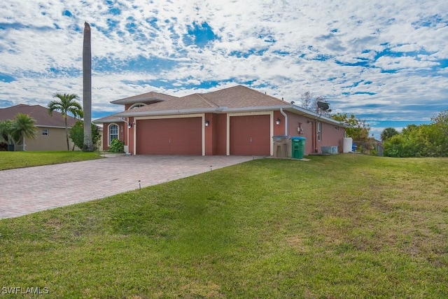 view of front of property with a garage and a front yard