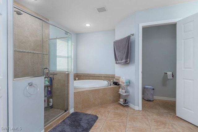 bathroom with independent shower and bath and tile patterned floors