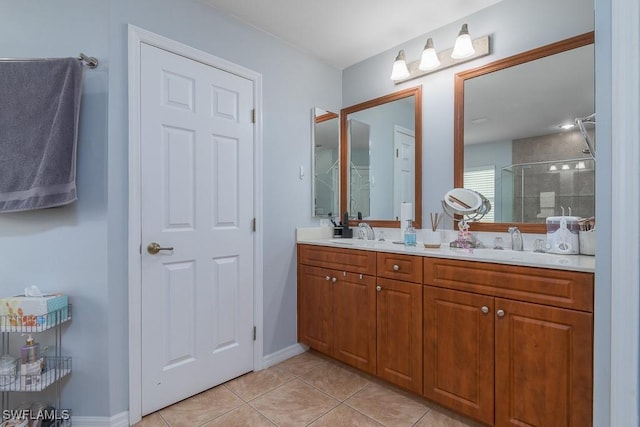 bathroom with tile patterned floors, a shower with door, and vanity