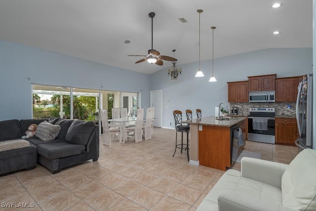 living room with ceiling fan, light tile patterned floors, and high vaulted ceiling