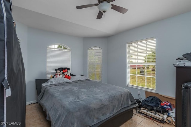 bedroom featuring ceiling fan and light tile patterned floors