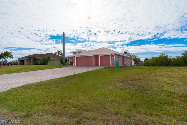 single story home featuring a front yard and a garage