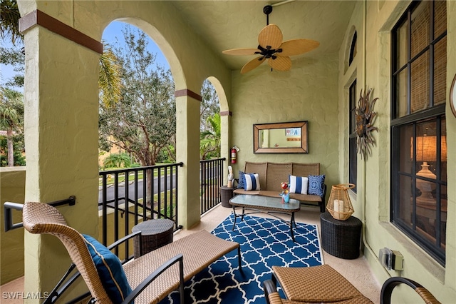 balcony featuring ceiling fan