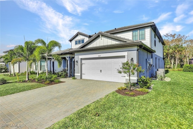 view of front facade with a garage and a front lawn