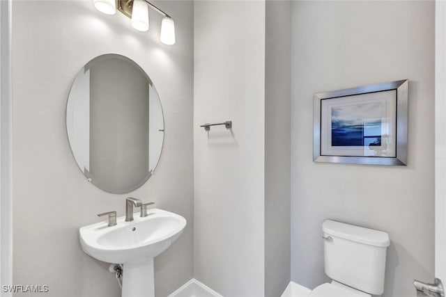 bathroom with sink and toilet