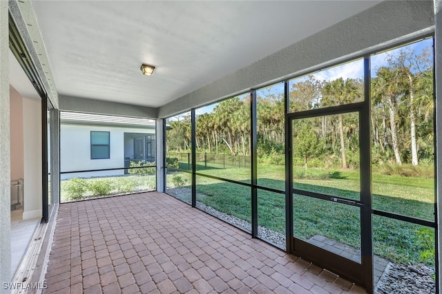 unfurnished sunroom with plenty of natural light