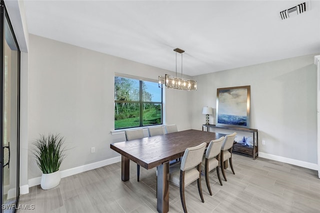 dining room featuring a notable chandelier