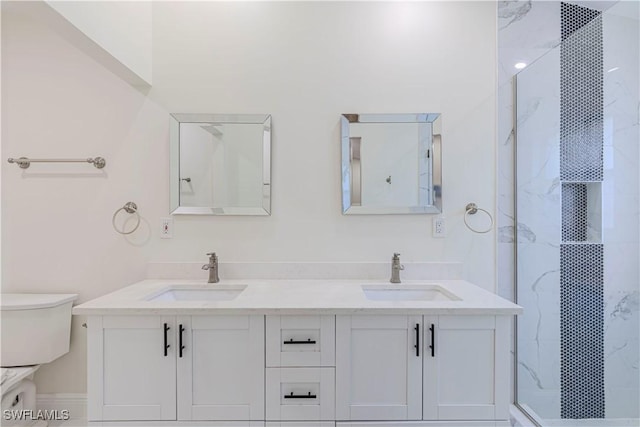 bathroom with vanity and a shower with door