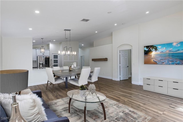 living room with dark hardwood / wood-style floors and lofted ceiling