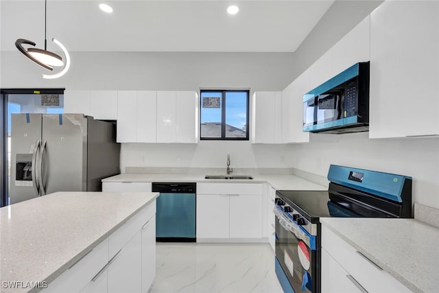 kitchen with sink, white cabinetry, stainless steel appliances, light stone countertops, and decorative light fixtures