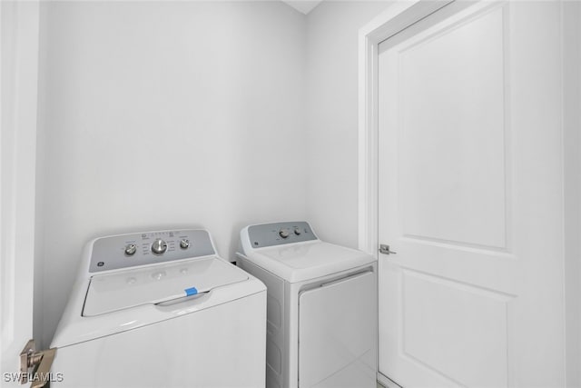 washroom featuring separate washer and dryer