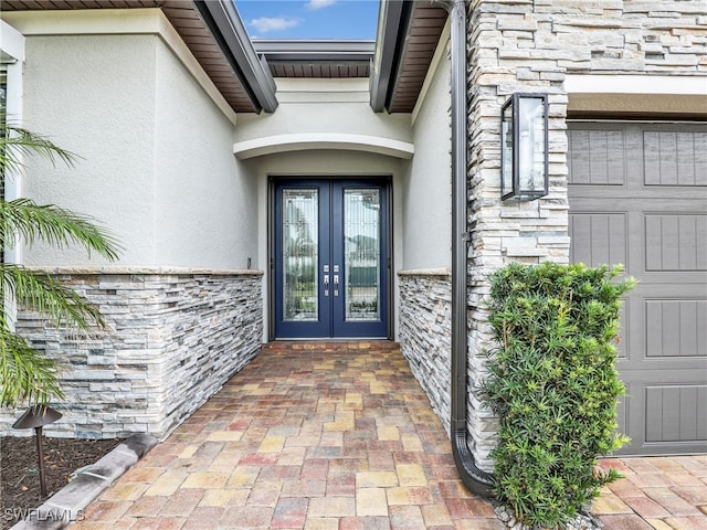 property entrance featuring french doors