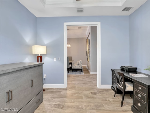 home office featuring ornamental molding and light wood-type flooring