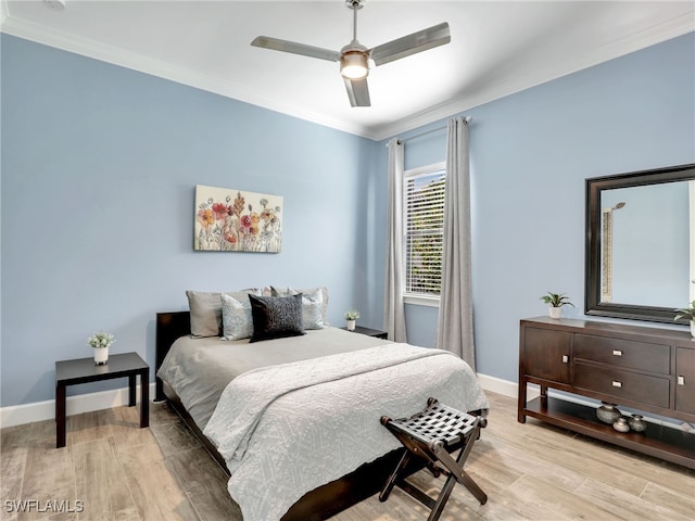 bedroom featuring light wood-type flooring, ceiling fan, and crown molding