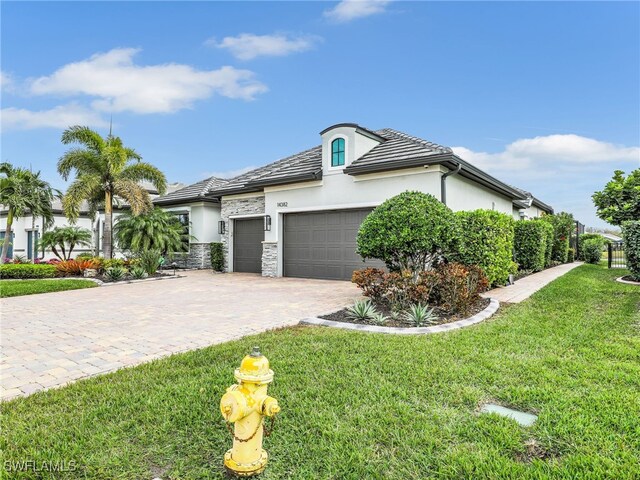 view of front facade featuring a front yard and a garage