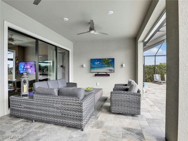 view of patio / terrace with an outdoor hangout area, ceiling fan, and glass enclosure