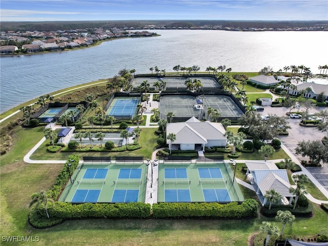 birds eye view of property with a water view