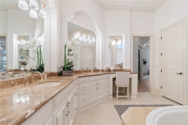 bathroom with vanity and ornamental molding