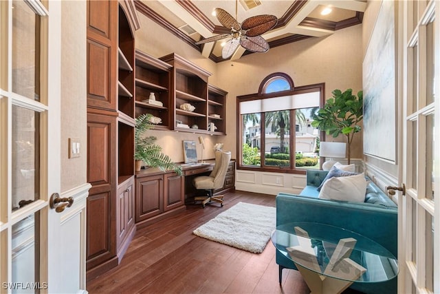 office with coffered ceiling, built in desk, dark hardwood / wood-style flooring, french doors, and beamed ceiling