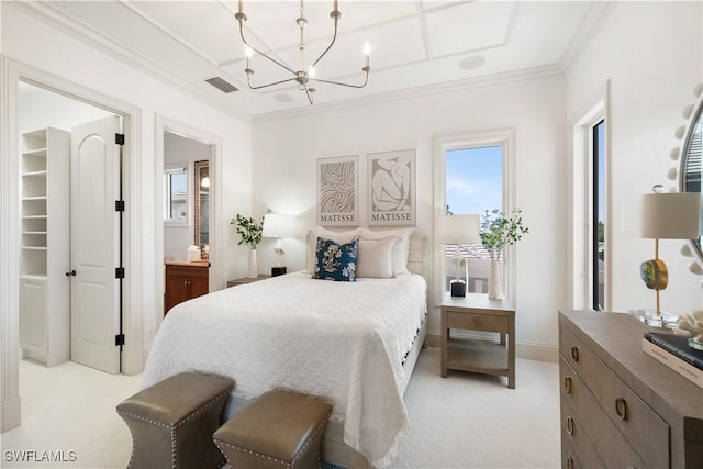 bedroom with crown molding, light colored carpet, an inviting chandelier, and ensuite bath