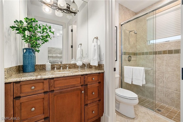 bathroom with walk in shower, tile patterned floors, vanity, and toilet