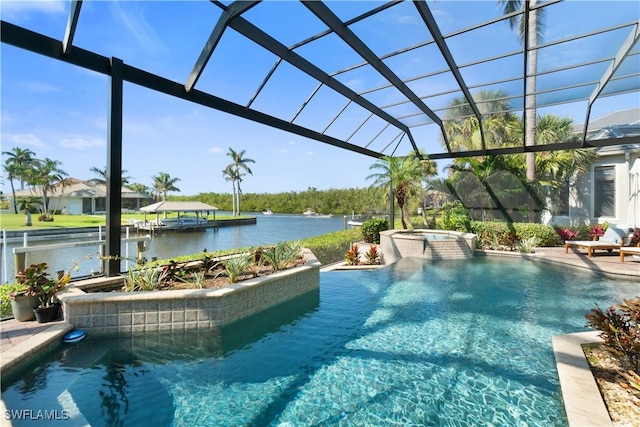 view of pool with a patio area, an in ground hot tub, a water view, and glass enclosure