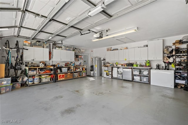 garage with fridge, a workshop area, water heater, and a garage door opener