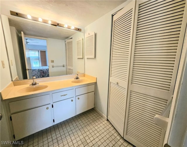 bathroom with vanity and tile patterned floors