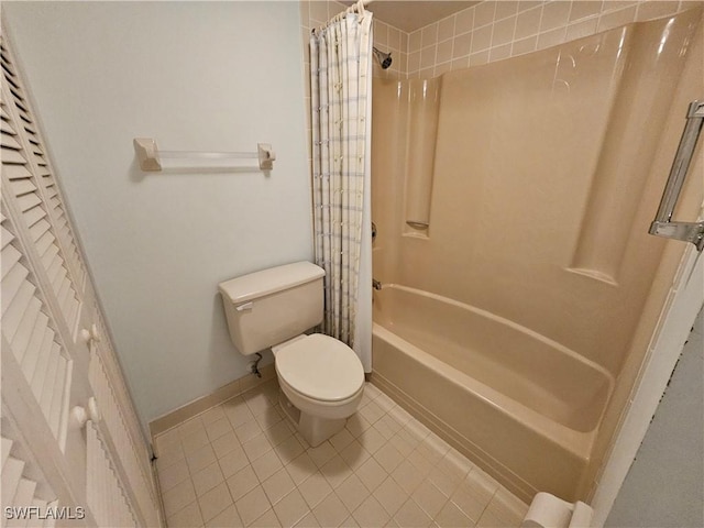 bathroom with tile patterned floors, toilet, and shower / bath combo