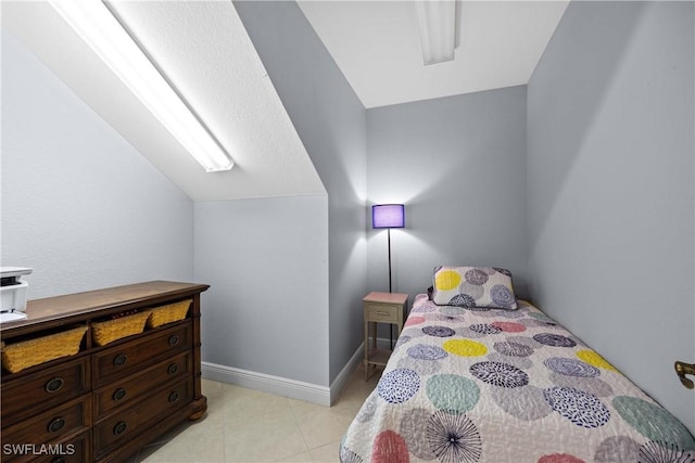 bedroom featuring vaulted ceiling